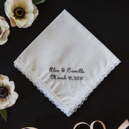 Wedding handkerchief embroidered with names and date. Shown personalized in grey thread.