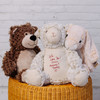 Custom embroidered handwriting on stuffed animals. Lamb, bear and rabbit stuffed animals sitting together.