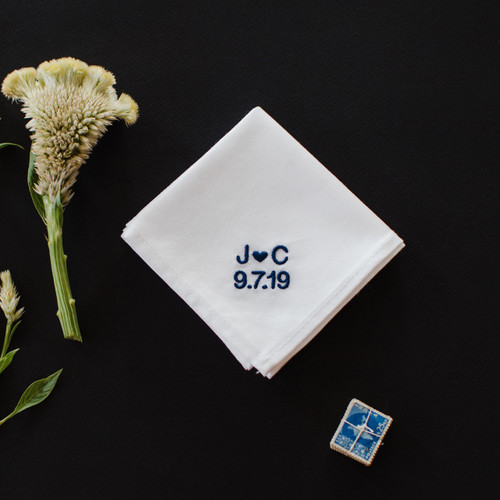 Men's wedding handkerchief for the groom embroidered with the couple's initials and wedding date.