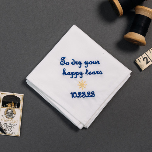 Happy tear white handkerchief with embroidered message, personalized date and sun in light gold.