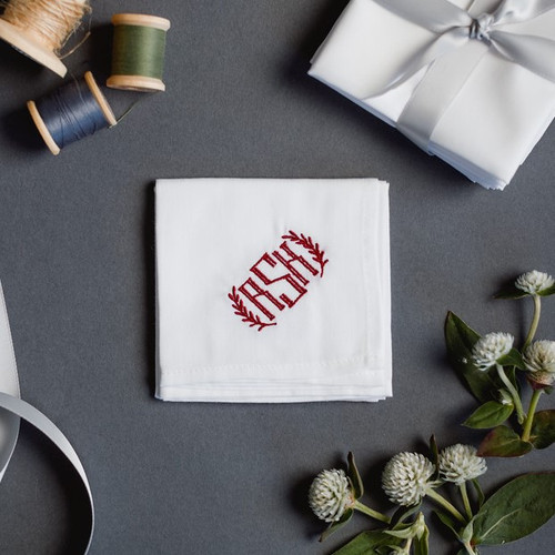 Monogrammed handkerchief embroidered with a vine style monogram.  The handkerchiefs are white with merlot embroidery thread.