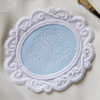 Monogrammed bridal patch for something blue with white embroidery thread on powder blue fabric.